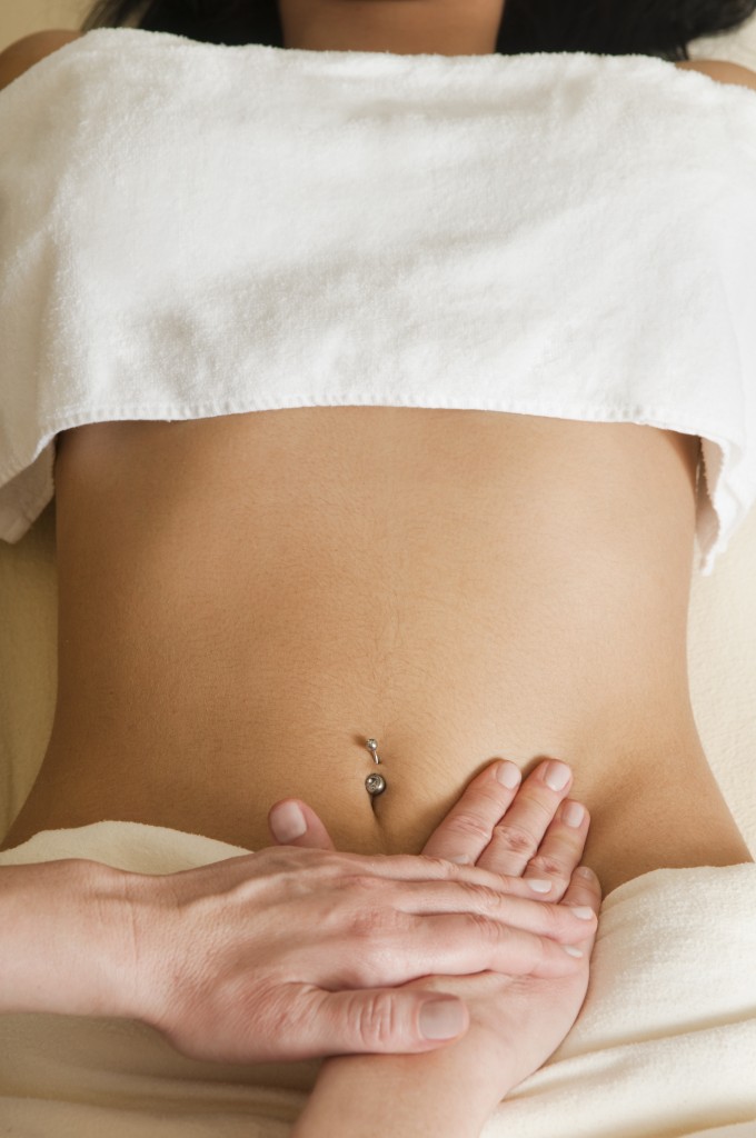 woman receiving lymphatic massage on abdomen